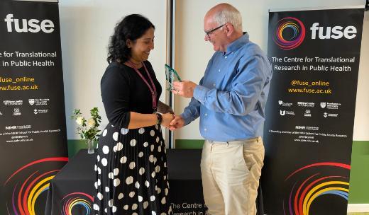 Neha Jain awarded by Professor Brian Ferguson